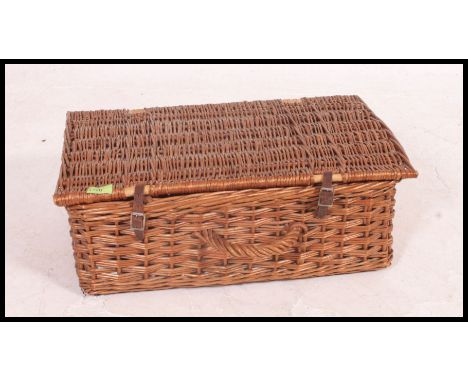 A retro vintage whicker mid century picnic hamper, with  contents to include a Thermos flask