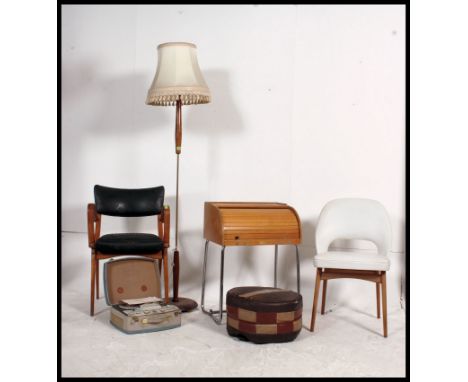 A retro 1950's childs school desk together with a dansette leg coffee table, teak standard lamp, retro Ben Chair in vinyl uph