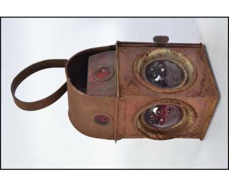 A vintage 20th century railways signals / guards lamp, having textured red glass and finished in red paint. Measures H42 x W1