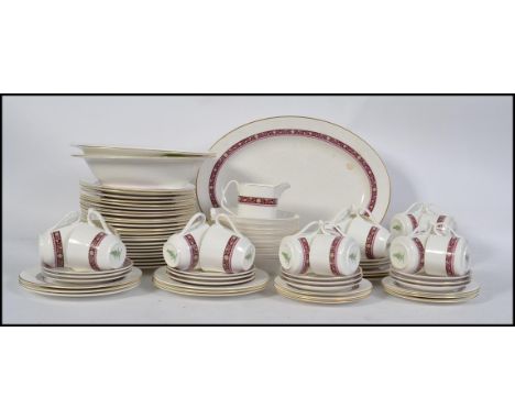 A Royal Doulton Minuet dinner / tea service / part service model H5026 comprising cups, saucers, plates etc