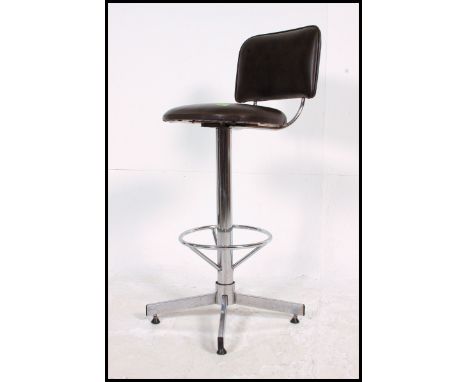 A vintage industrial vinyl and chrome workshop / machinists swivel chair c1970s. No makers name. Four chrome legs, with circu
