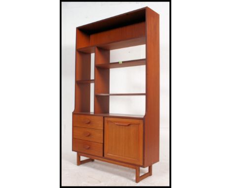 A vintage mid century teak room divider sideboard having 3 drawers to eft with drop cupboards to right having open shelving a