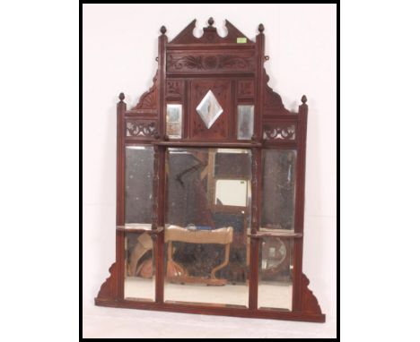 A 19th century Victorian mahogany over mantle mirror, having shelf to top with reeded decoration and carved decoration to ped