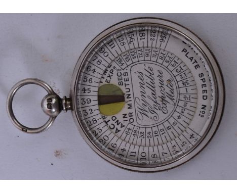 A 19th century silver cased Wynnes Infallible Exposure Meter. The paper face set within engine turned case. Hallmarked to the