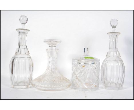 A pair of early 20th century cut glass decanters together with stoppers along with a ships decanter ( stopper af) and a glass