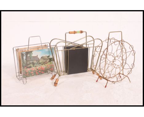 3 vintage mid century wirework magazine racks, each with ball finals / carry handles to centre ( see illustrations ). Measure