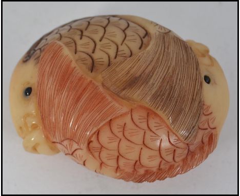 An unusual Chinese carving / netsuke type in the form of two intertwined carp fish
