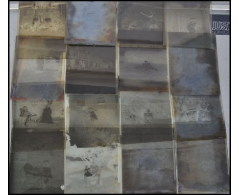 A quantity of Victorian / Edwardian glass negative slides, mainly portrait photos, with a wooden carry case
