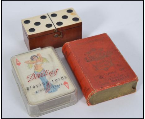 A great set of 1950's saucy playing cards, a bone and wood miniature dominoes set in case, and a vintage Lexicon game