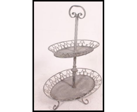 A vintage mid century unusual galvanised metal two tier garden planter stand with carry handle to centre, each lozenge shaped