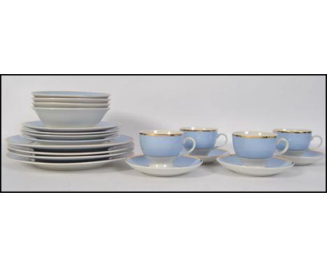 A modern Royal Doulton tea service with a classical blue band stripe pattern, blue white with gold rim being stamped to the b