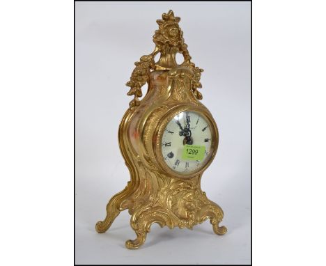 A French style mantel clock  with movement by Franz Hermle, Germany, striking on a bells with 8 day movement.  The ornate gil
