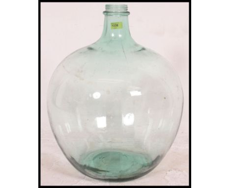 A vintage 20th century large bulbous glass acid carboy bottle with thin waisted neck. Measures H38 x W38 x D38 (cm).
