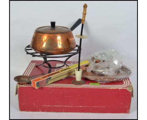 A retro 1970's cased spring of Switzerland Gourmet Line Fondue set, consisting of pan, burner, forks, fork holder etc