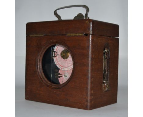 A vintage wooden cased Belgian chrome pigeon clock. The chrome barrel clock with glass facia and original case