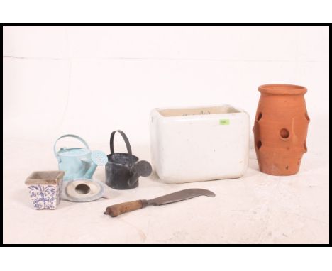 A vintage mid 20th century Belfast sink of small proportions along with some other garden items