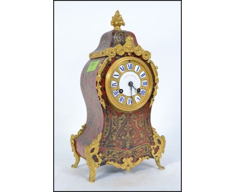 A 19th century Delettrez and Achille Brocot Paris, France boulle work mantel clock. Raised on gilt metal ormulu feet with ena