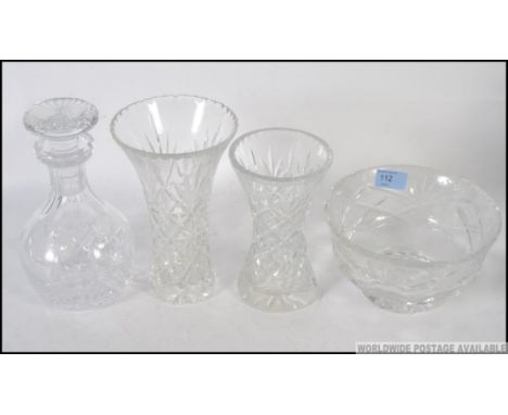 A cut glass Edinburgh Crystal decanter along with a Stuart decanter and matching glasses.