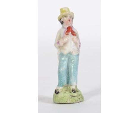 An 18th century / 19th century  Continental ceramic pipe taper in the form of a country / peasant gentleman raised on flat pl