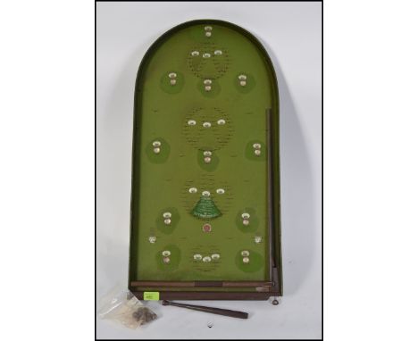 A good early 20th century bagatelle board with green background, wooden frame, model Corinthian 1951 Abbey Model.