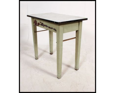 A vintage mid century enamel metal top and painted pine side table having end drawer with green painted finish to the base H7