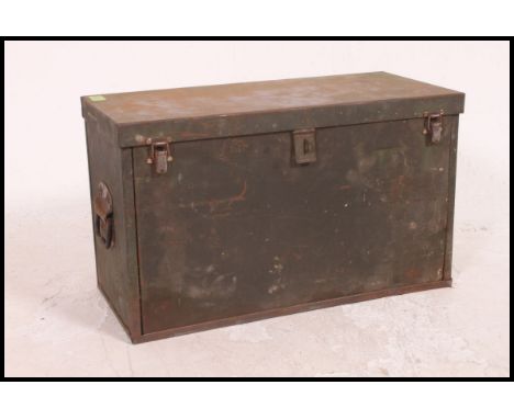 A fabulous vintage green industrial metal military tool chest, complete with tuck away front opening flap. Opening top panel 