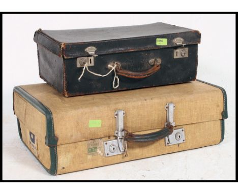 2 vintage 20th century suitcases to include one being a vanity lined sectional case. Measures H38 x W28 x D42.