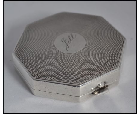 A silver hallmarked compact, with Birmingham Assay marks, date letter for 1932 by John Henry Wynn W5cm 46.5g