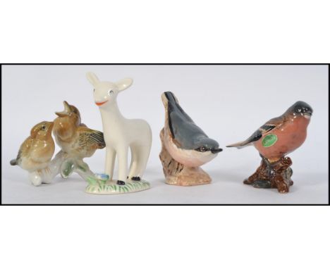 A Larry The Lamb Midwinter ceramic figurine marked to base together with a collection of ceramic bid figurines.  3 small bird