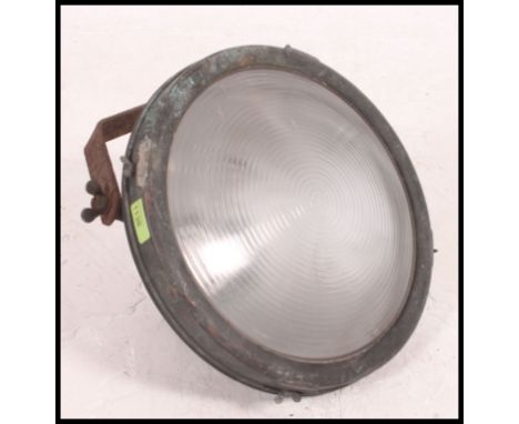A vintage 20th century maritime copper search light, having a large adjustable bracket to the rear. Measures H35 x W35 (cm).
