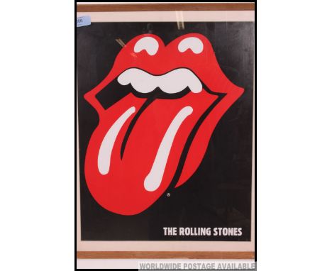 A framed and glazed Rolling Stones poster of the iconic bands lips, presented in a glazed frame