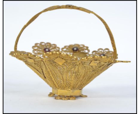 A vintage beautiful 20th century miniature filigree worked yellow metal bon bon dish adorned with enamel painted flowers and 