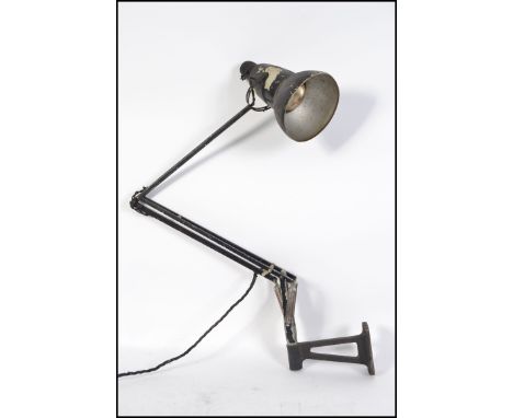 A vintage industrial workers wall mountable Herbert Terry anglepoise lamp, with original Crabtree shade. Measures H97cm. 