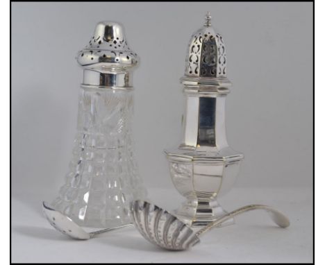 A silver hallmarked sugar caster bearing assay marks for Sheffield 1951 by Walker and Hall . Total weight 102.5g. Together wi