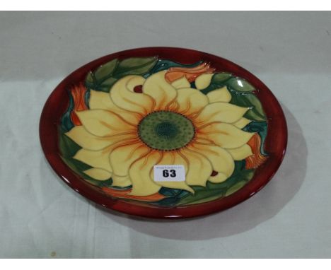 A Circular Moorcroft Pottery Charger With Sunflower Centre