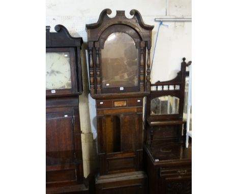 An Antique Oak And Mahogany Encased Long Case Clock Enclosing An Arched Painted Dial With Eight Day Movement