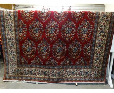 An Excellent Floral Pattern Red Ground Tabriz Woollen Carpet, 18'11" X 9'7"