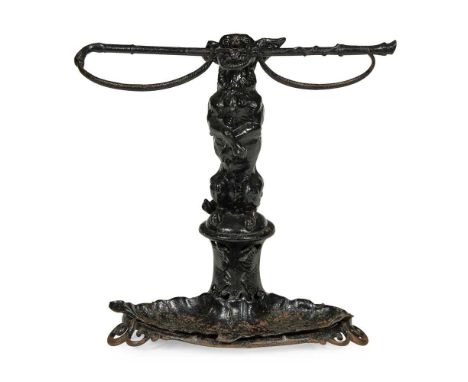 VICTORIAN COALBROOKDALE CAST IRON STICK STAND 19TH CENTURY modelled as a begging dog holding a whip in its mouth, above a lea