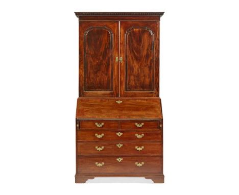 GEORGE II MAHOGANY BUREAU BOOKCASE MID 18TH CENTURY the dentil moulded cornice above a pair of shaped moulded panel doors ope