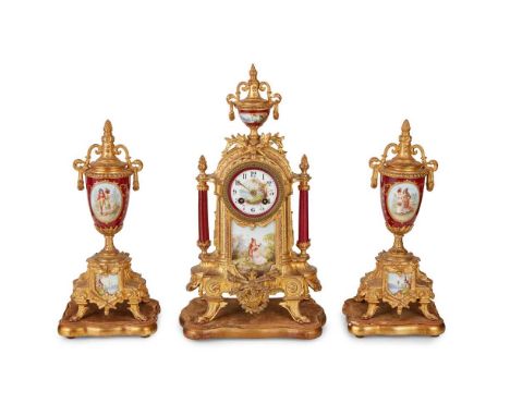 FRENCH PORCELAIN AND GILT METAL THREE PIECE CLOCK GARNITURE 19TH CENTURY  the arch case with an urn finial above the painted 