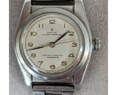 A 1940s Rolex Oyster Perpetual Chronometer 'bubble back' wristwatch, no. 402316, with champagne dial, 24mm, Arabic numerals, 
