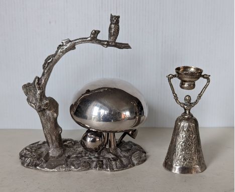 An Edwardian silver plated table bell, in the form an owl perched on a branch over a group of toadstools, on a naturalistic b