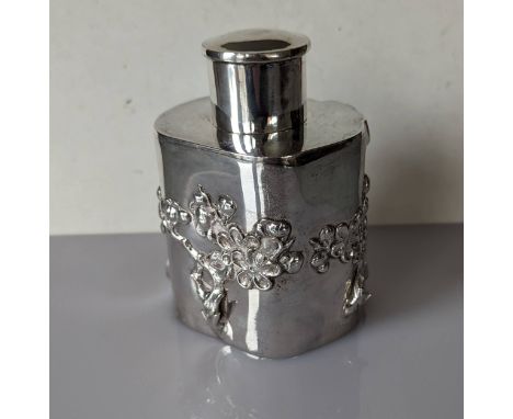 A late 19th century Chinese silver prunus root-shape tea caddy with applied blossoming branches, push-fitting cover, 12cm hig