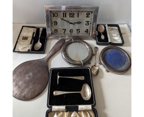 Two round silver photo frames, 13.5, 12 cm; a silver vanity mirror with engine turned design; three presentation silver chris