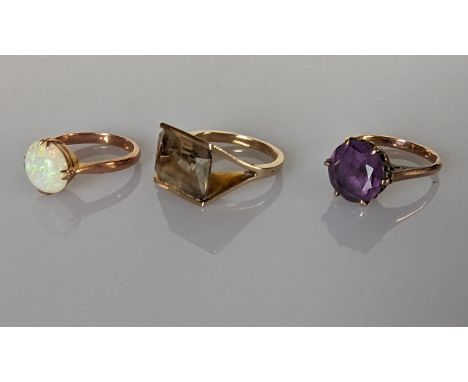 A vintage emerald-cut citrine ring in a split-shank gold setting, the citrine 15 x 10mm, 6.5g; a round-cut amethyst ring in a