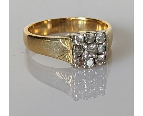 A diamond cluster ring on an 18ct yellow gold panel setting, the nine round-cut diamonds approximately 0.65 carats, size P, s