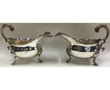 HESTER BATEMAN: A rare pair of 18th Century crested silver sauce boats. London 1787. Approx. 325 grams. Est. £400 - £600.