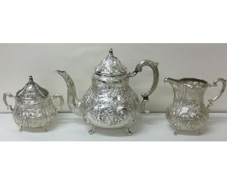 A very decorative early 20th Century German silver three piece tea set embossed with cherubs. Approx. 1680 grams. Est. £1200 