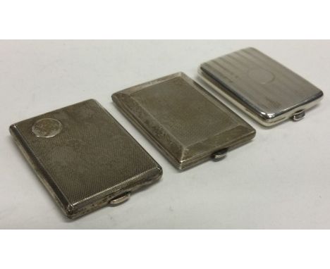 Three heavy engine turned silver stamp cases. Approx. 107 grams. Est. £150 - £180.