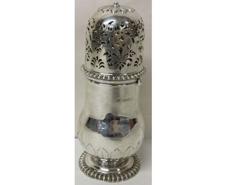 An oversized Victorian silver sugar caster. London 1886. By John Aldwinckle and Thomas Slater. Approx. grams. Est. £400 - £60